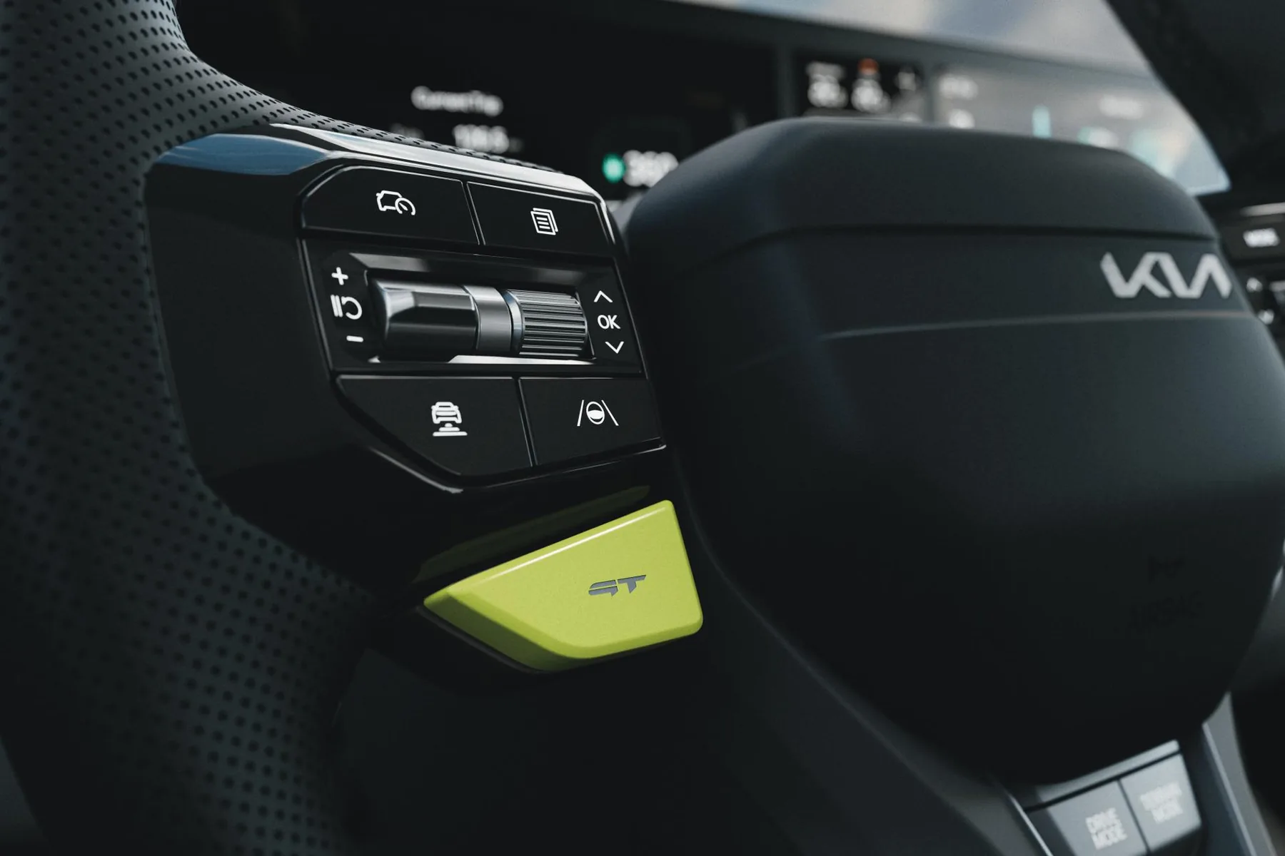 Lenkrad des Kia EV9 GT mit neongrüner GT-Taste