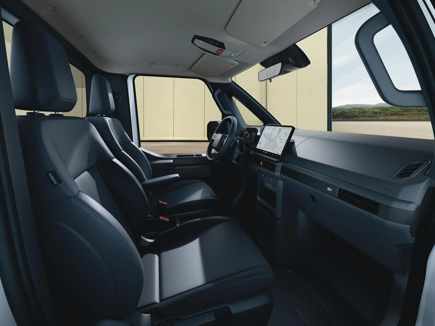 Fahrerhaus des Kia PV5 Chassis Cab mit Lenkrad und Display